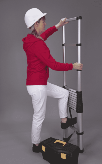 holding a telescopic ladder