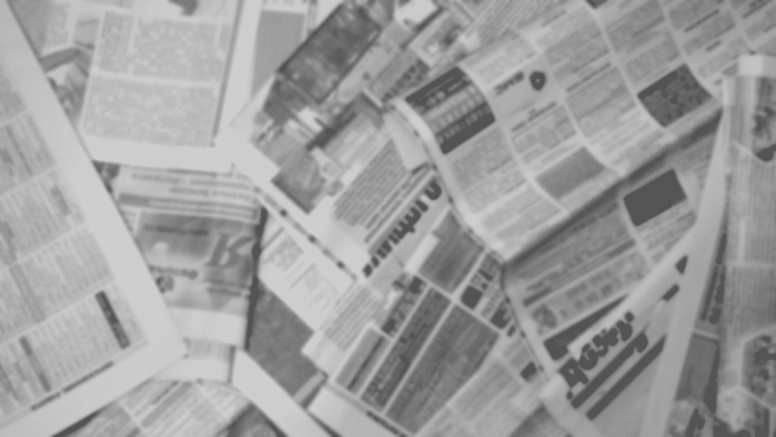 old-newspapers-scattered-on-floor repairdaily.com