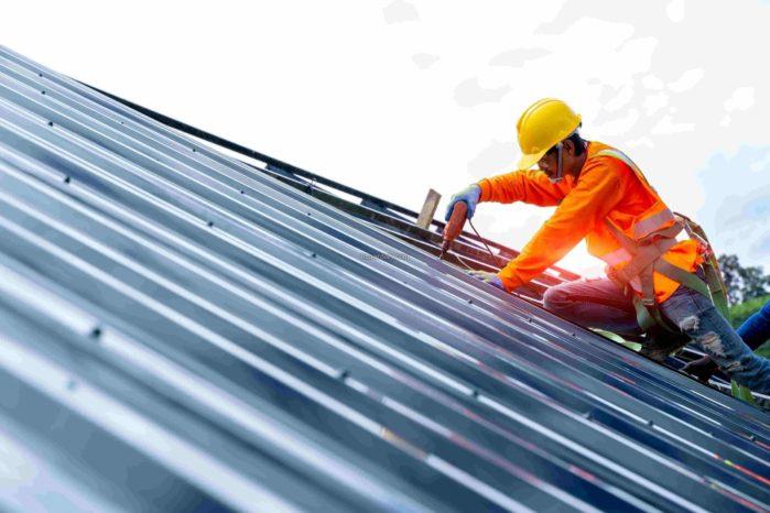 man working on roof