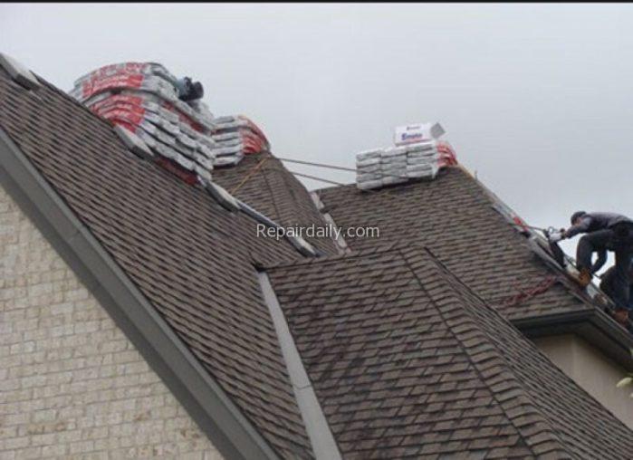 man repairing roof