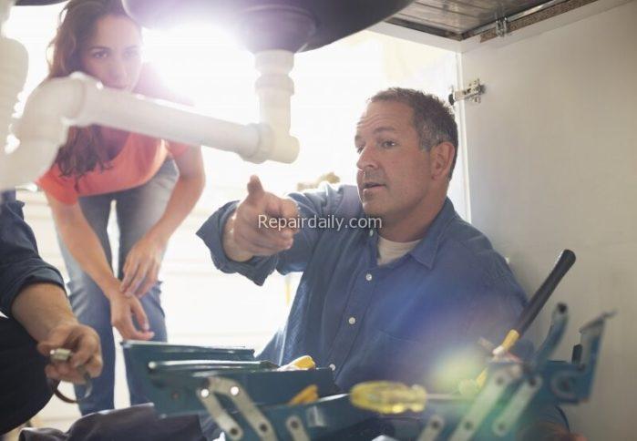 plumber showing plumbing repair