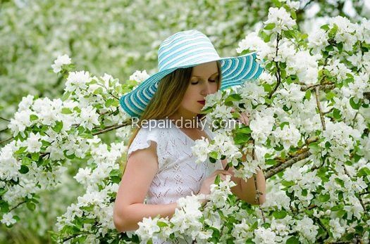 lady smelling flowers