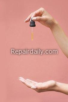 cbd oil drop on hand