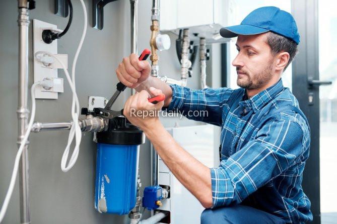 plumber working on plumbing