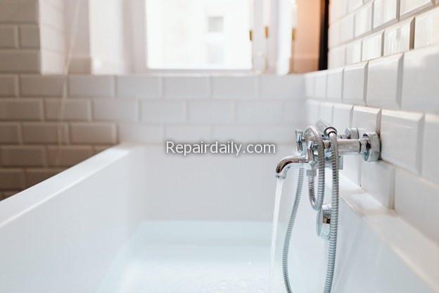 water tap filling bath tub bathroom