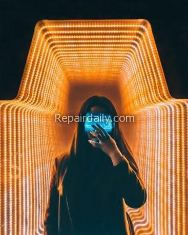 man posing in front of led lights