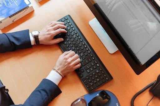 man using pc desktop laptop