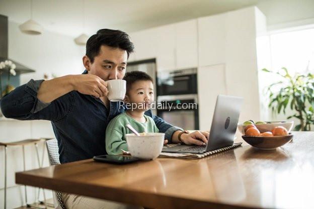 man working from home office with son