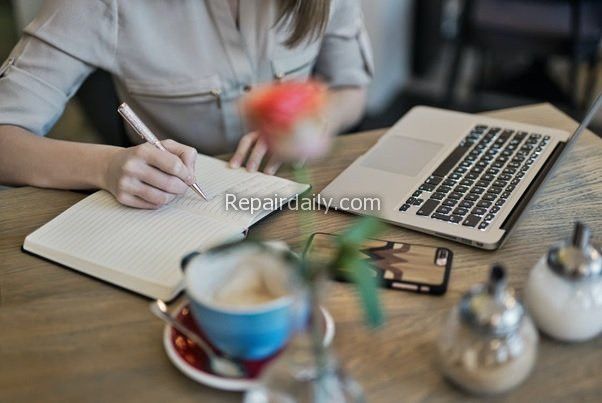 lady working on laptop and studying writing