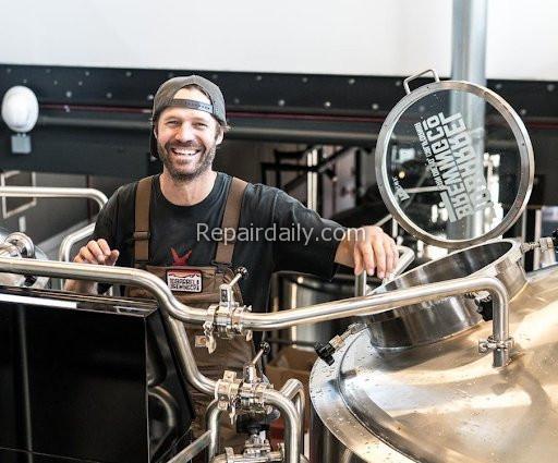 man working on stainless steel