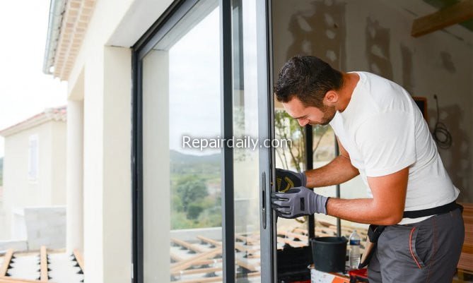 man fixing window