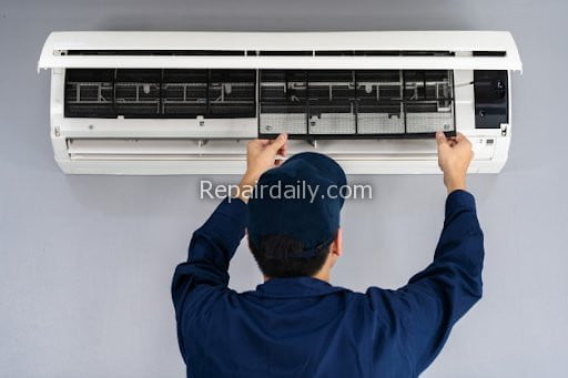 man repairing air conditioner