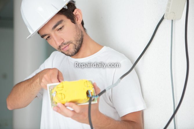 electrician fixing electric appliance