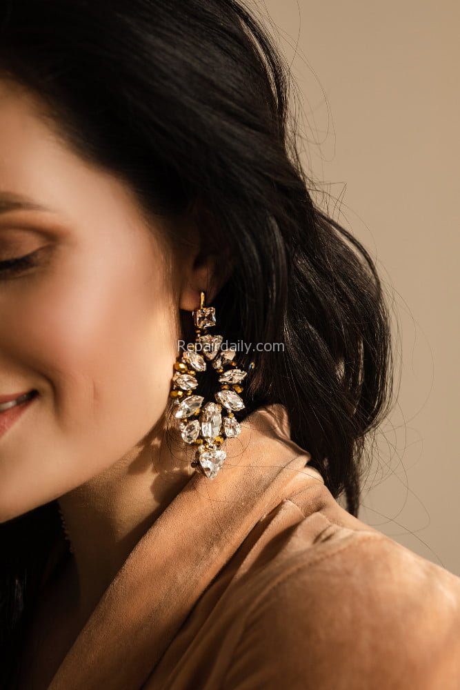 portrait-young-woman-with-earrings-with-gems-isolated