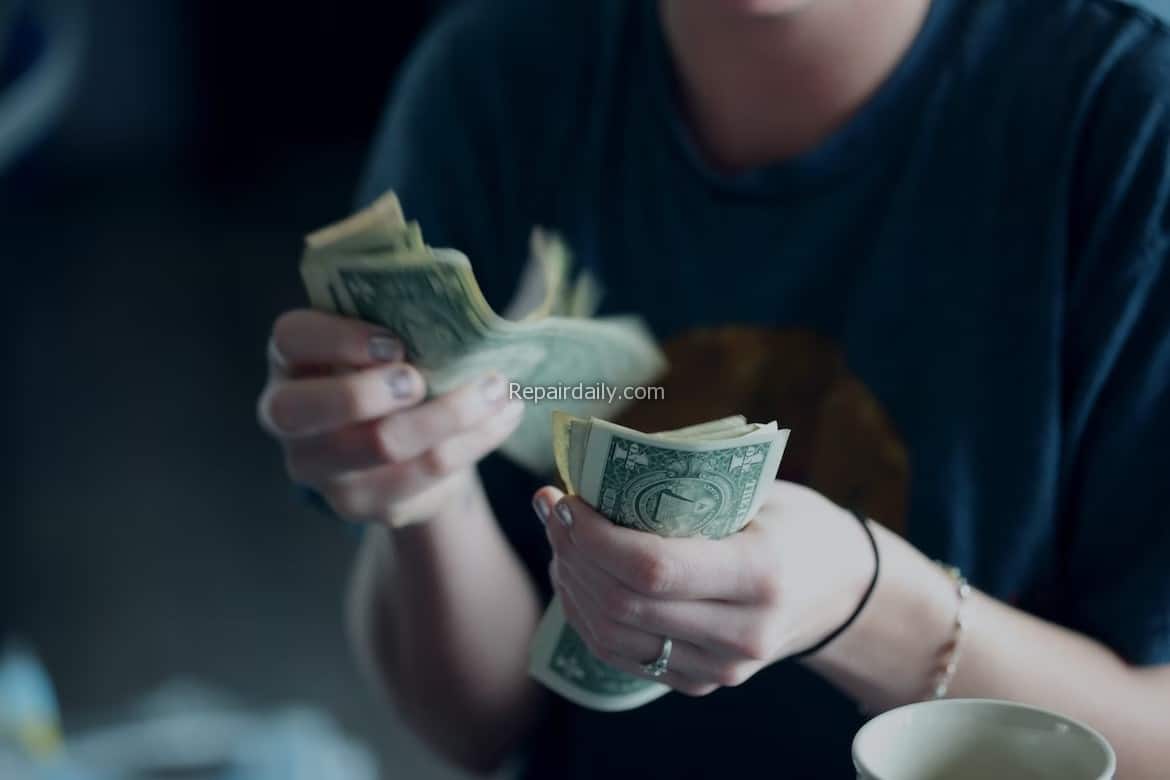 man counting money bills