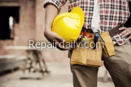 construction worker with tools and helmet