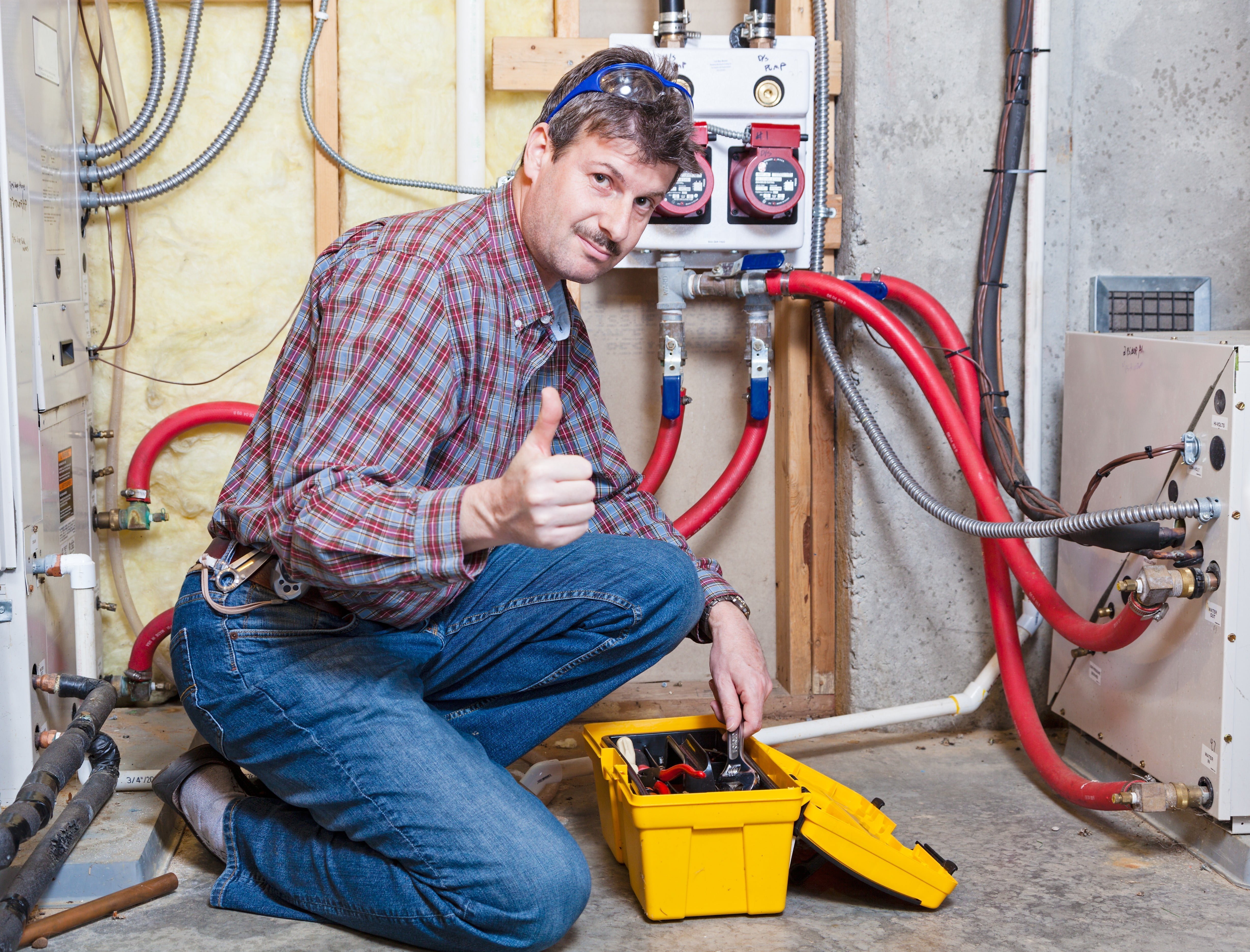 Happy handyman showing thumbs up